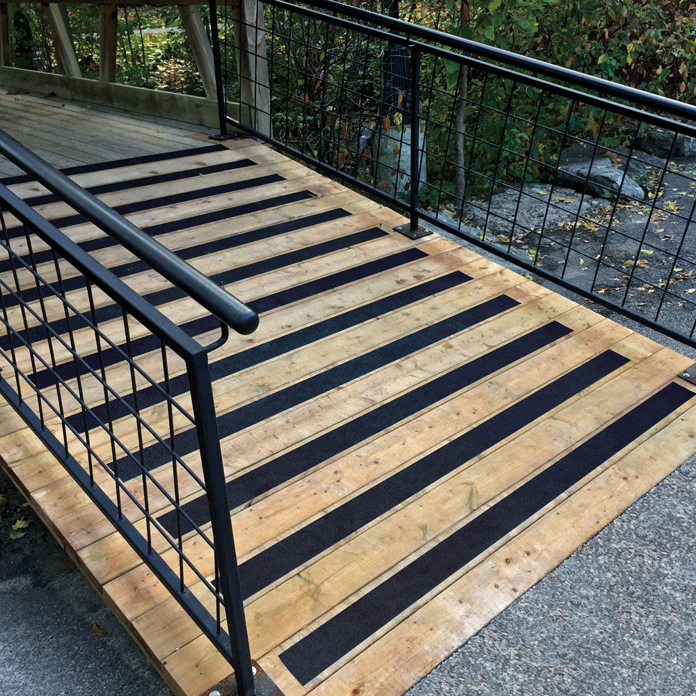 Gator Grip® Advanced Premium Black Anti-Slip Grip Roll 60-grit Traction Tape Applied in strips to a wheelchair accessible ramp