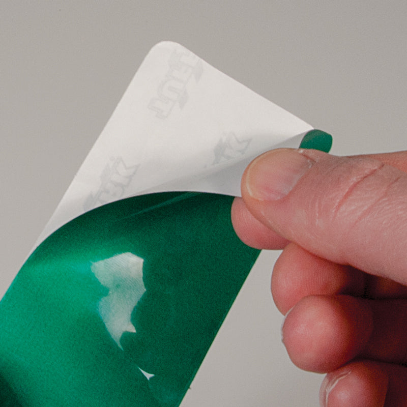 TM100G Green "-" Shape 5S/Lean Tuff Mark™ High Traffic Durable Warehouse Adhesive Warehouse Floor and Position Markers (20 /pkg) pealing up the corner off of the liner