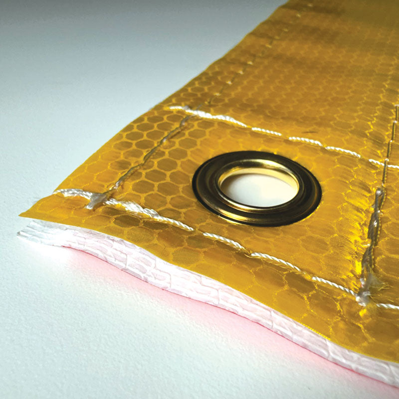 TS8015DSBR Ultra Durable OVERSIZE LOAD / "D" Double Sided Over-Dimensional Load Sign Refelctive Banner (12 in x 96 in) Close up of grommet on OVERSIZE LOAD side