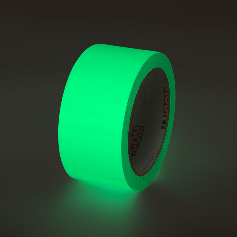 523522P Plain  Glow-in-the-Dark Phololuminescent Adhesive Safety Tape (2 in x 30 ft) glowing under low light conditions