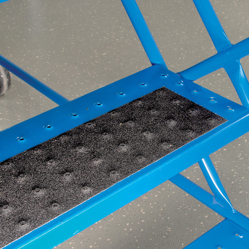 SG4104AL Gator Grip® Conformable Foil Backed Black Anti-Slip Grip Roll 46-grit Traction Tape (4 in x 60 ft) applied to uneven surface of blue rolling stairs