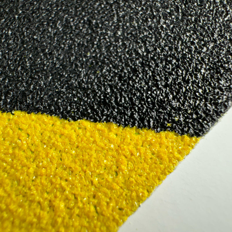 Gator Grip® Conformable Foil Backed Yellow/Black Anti-Slip Grip Roll 46-grit Traction Tape close up of grit surface
