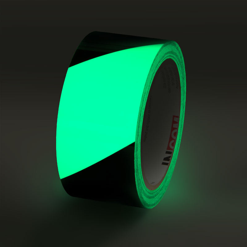 GT230BK Glow/Black Stripe Glow-in-the-Dark Phololuminescent Adhesive Safety Tape (2 in x 30 ft)  glowing under low light conditions