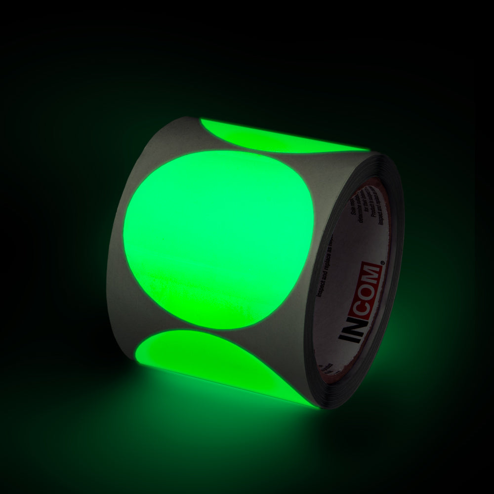 GTCL30  Glow-in-the-Dark Phololuminescent Adhesive Safety Tape 3 inch diameter circle Die Cut Shapes (100 /roll) showing glow feature in low light