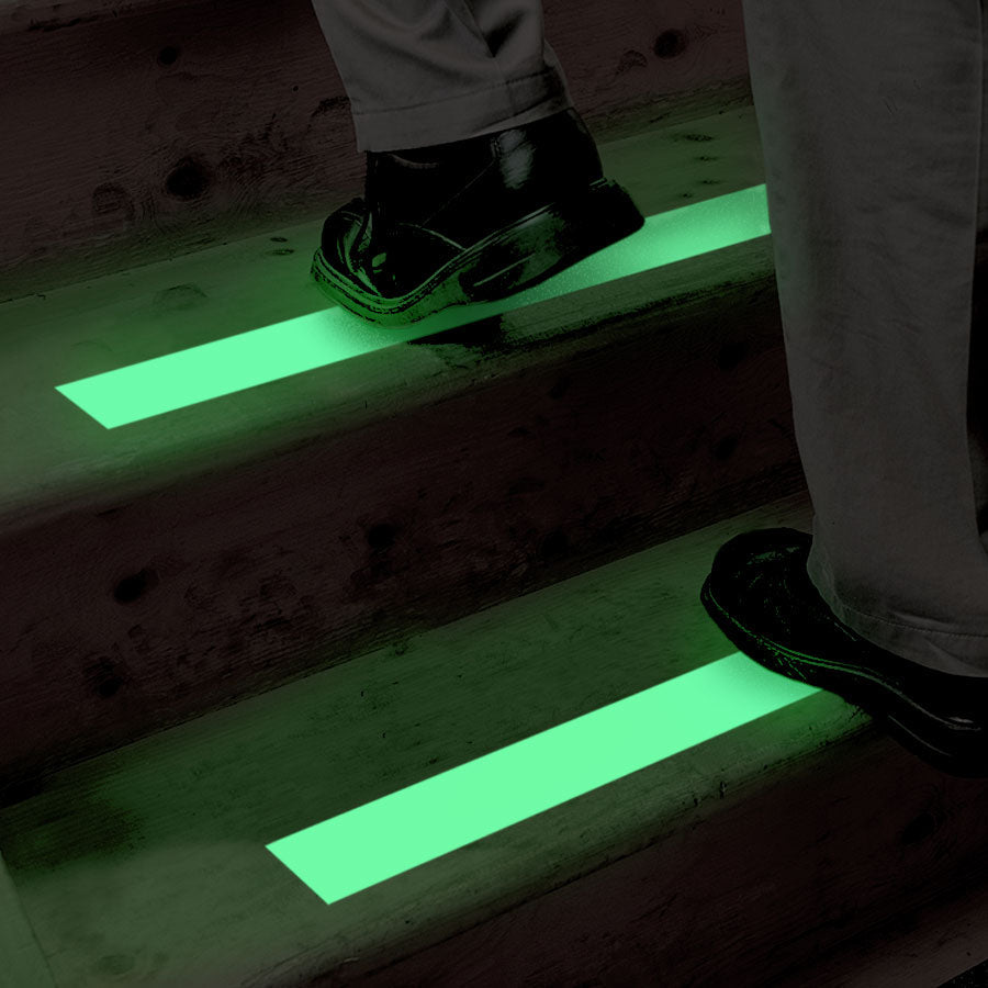 SG4202PH Gator Grip® Premium Photoluminescent Glow-in-the-Dark Anti-Slip Grip Roll 60-grit Traction Tape (2 in x 60 ft) glowing in the dark in a darkened stairway application