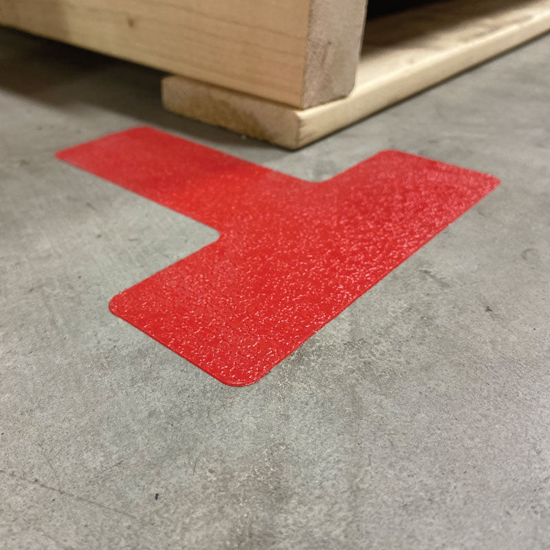 Red  "T" Shape 5S/Lean Textured Anti-Slip Grip Adhesive Warehouse Floor and Position Markers (25 /pkg) applied to the warehouse floor