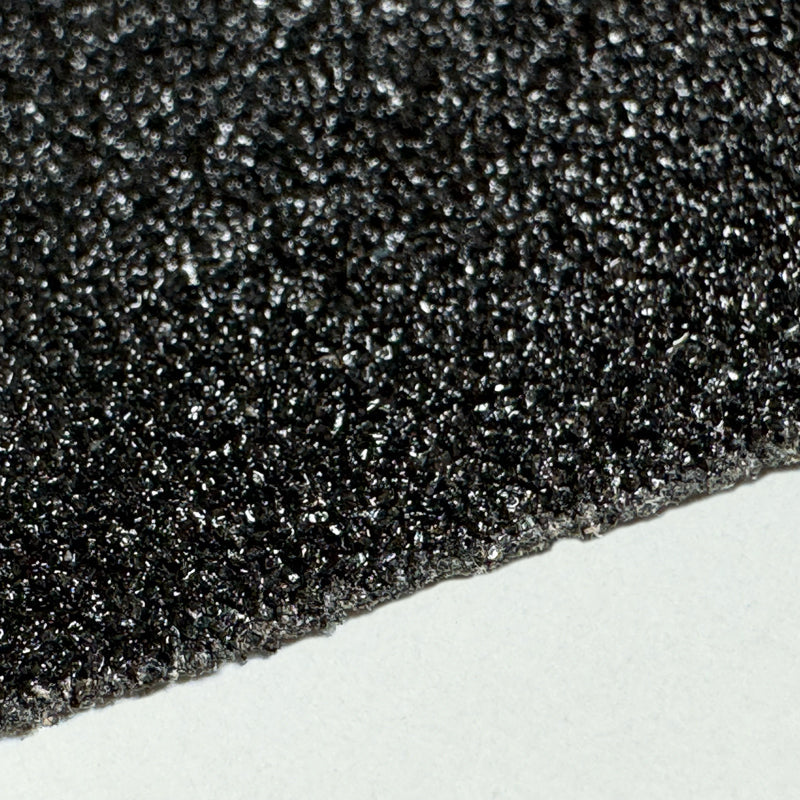 Gator Grip® Premium Black Military & Marine NAVSEA & MIL-PRF Spec. Roll 36-grit Anti-Slip Grip Traction Tape close up of grit surface