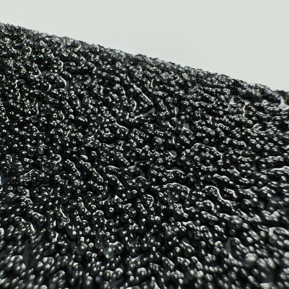 Gator Grip® Mopper's Friend Black Mop Friendly Roll Anti-Slip Grip Traction Tape close up shot of grit particles