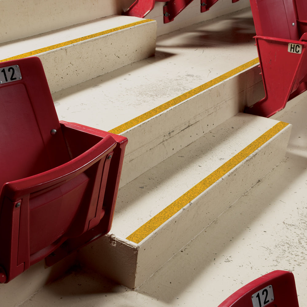SG6202Y Gator Grip® Yellow Stadium Track Anti-Slip Grip Roll 46-grit Traction Tape (2 in x 60 ft) applied to stadium stairs