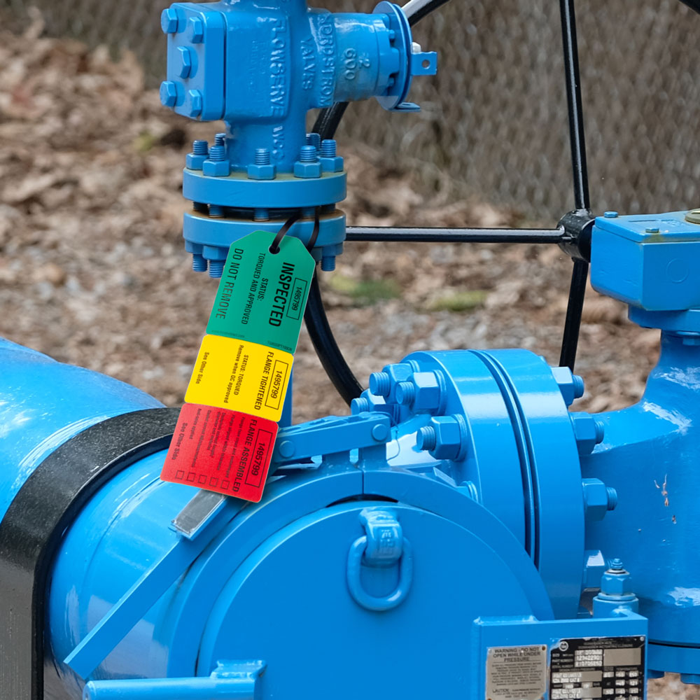 TG8033PT TG8033PT100 3-Part Perforated FLANGE TORQUE INSPECTION DuraPly™ Tag (2.75 in x 7.9 in) attached to a flange