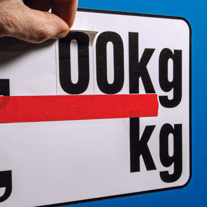 TS8351V G.V.W. (Gross Vehicle Weight) Truck Number being applied to the template using masking tape to line the numbers up