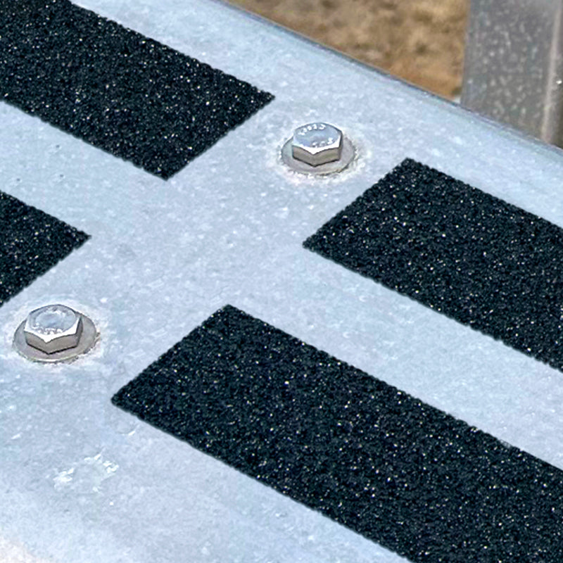 SG3810MIL4 Gator Grip® Premium Black Military & Marine NAVSEA & MIL-PRF Spec. Roll 36-grit Anti-Slip Grip Traction Tape  (4 in x 30 ft) applied to a trailer fender