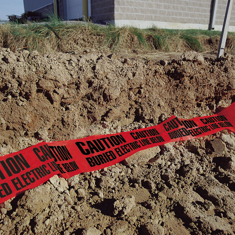UT-series Underground Utility Marking Warning Roll Tape being laid into a trench